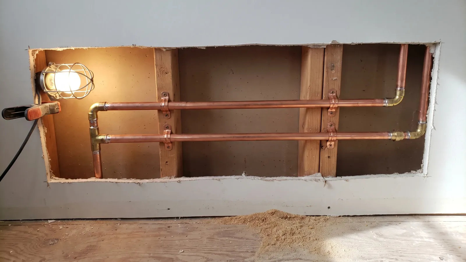 Finished copper repipe inside an open wall, straight runs and clean joints